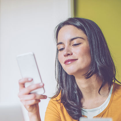 Lady using her smartphone for mobile banking